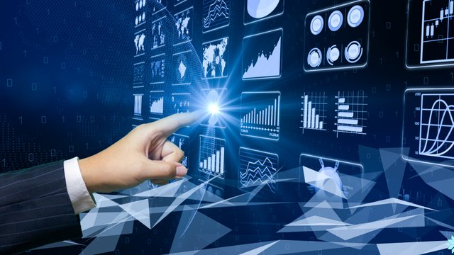 Hand touching a dashboard of data visualizations